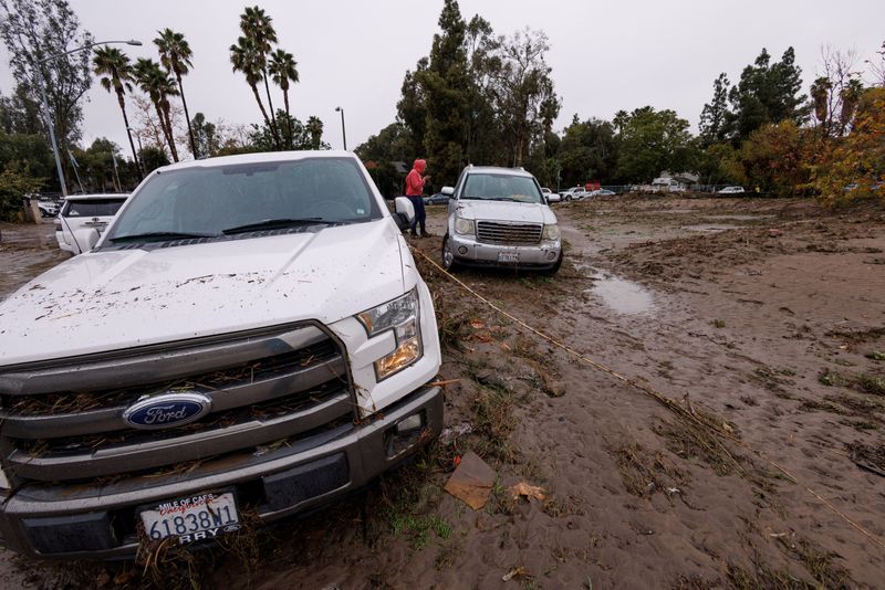 &copy; Reuters. FILE PHOTO: Damage is shown after a heavy rain storm causes a small river to overflow into a neighborhood in San Diego, California, U.S. January 22, 2024.  REUTERS/Mike Blake