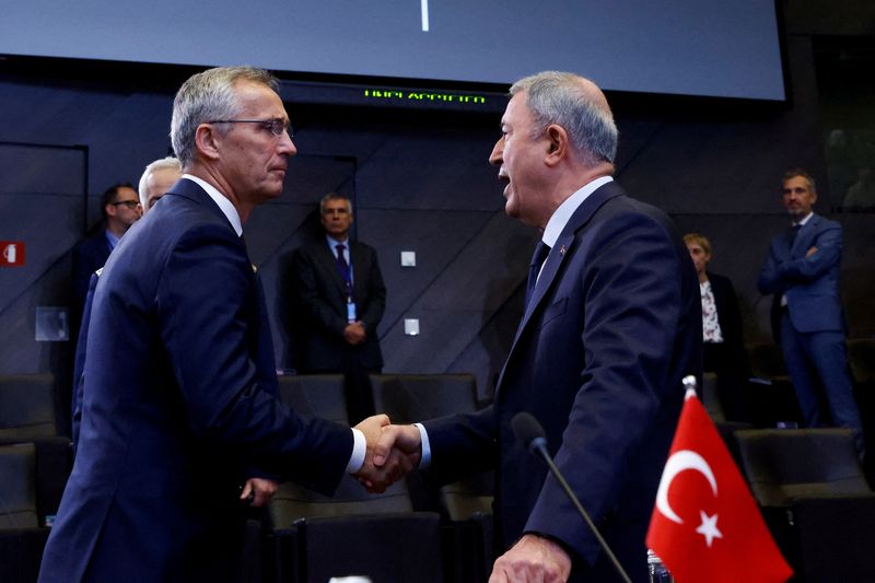 © Reuters. FILE PHOTO: NATO Secretary General Jens Stoltenberg and Turkey's Defence Minister Hulusi Akar attend North Atlantic Council during a NATO defence ministers meeting, with Finland and Sweden as invitees, at the Alliance's headquarters in Brussels, Belgium October 13, 2022. REUTERS/Yves Herman/File Photo