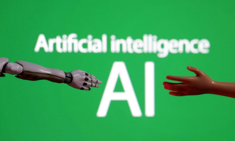 &copy; Reuters. Words reading "Artificial intelligence AI", miniature of robot and toy hand are pictured in this illustration taken December 14, 2023. REUTERS/Dado Ruvic/Illustration/File Photo
