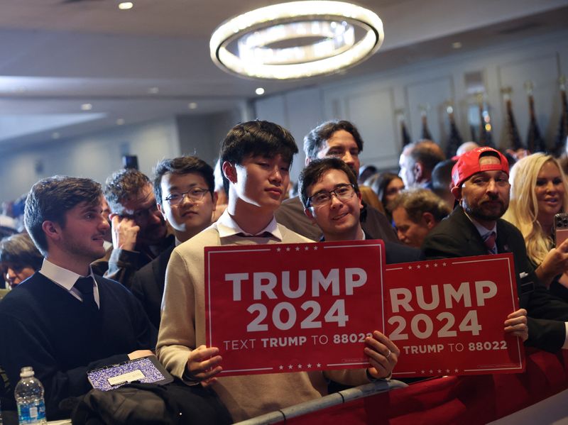 &copy; Reuters. Supporters of Republican presidential candidate and former U.S. President Donald Trump attend his New Hampshire presidential primary election night watch party in Nashua, New Hampshire, U.S. January 23, 2024. REUTERS/Mike Segar