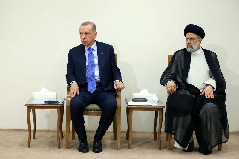 &copy; Reuters. Turkish President Recep Tayyip Erdogan sits next to Iranian President Ebrahim Raisi during a meeting with Supreme Leader Ayatollah Ali Khamenei (not pictured) in Tehran, Iran July 19, 2022. Office of the Iranian Supreme Leader/WANA (West Asia News Agency)