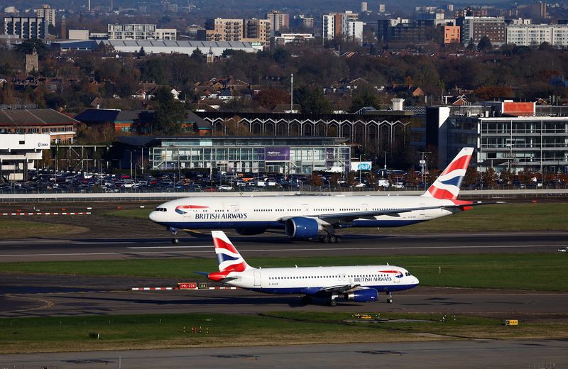 &copy; Reuters. A British Airways Boeing 777 passes a British Airways Airbus as it takes off from Heathrow Airport, in London, Britain, November 28, 2023.  REUTERS/Peter Nicholls/File Photo