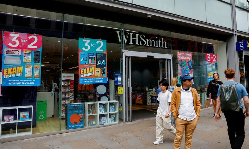 &copy; Reuters. FILE PHOTO: People walk past a WH Smith store in Manchester, Britain, May 26, 2023. REUTERS/Jason Cairnduff/File Photo