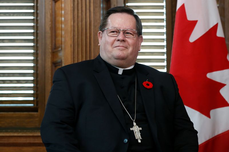 &copy; Reuters. FILE PHOTO: Cardinal Gerald Lacroix, Archbishop of Quebec, takes part in a meeting with Canada's Prime Minister Justin Trudeau in Trudeau's office on Parliament Hill in Ottawa, Ontario, Canada, November 6, 2017. REUTERS/Chris Wattie