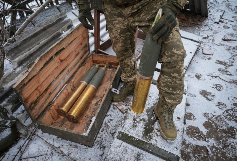 &copy; Reuters. A Ukrainian serviceman of 80th Separate Galician Air Assault Brigade prepares shells to fire a L119 howitzer towards Russian troops, amid Russia's attack on Ukraine, at a position near Bakhmut in Donetsk region, Ukraine January 25, 2024. REUTERS/Inna Vare