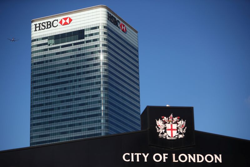 &copy; Reuters. HSBC's building in Canary Wharf is seen behind a City of London sign outside Billingsgate Market in London, Britain, August 8, 2018. REUTERS/Hannah McKay