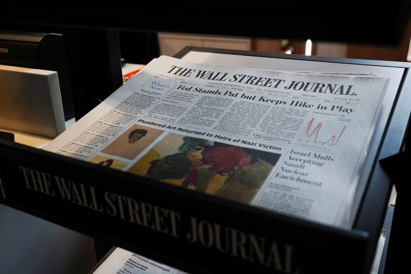 &copy; Reuters. Copies of The Wall Street Journal newspaper are displayed for sale at a newsstand inside Moynihan Train Hall, after the announcement that Rupert Murdoch would step down as chairman of News Corp and Fox in favor of his son Lachlan Murdoch, in New York City