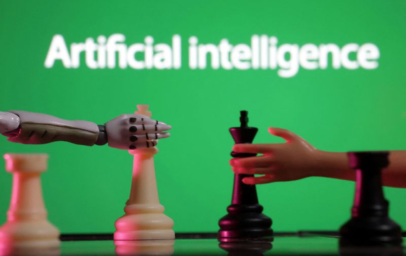 &copy; Reuters. Words reading "Artificial intelligence", miniature of robot and toy hand are pictured in this illustration taken December 14, 2023. REUTERS/Dado Ruvic/Illustration/File Photo