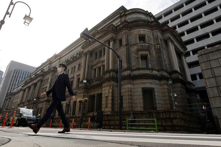 &copy; Reuters. A man walks in front of the headquarters of Bank of Japan in Tokyo, Japan, January 18, 2023.   REUTERS/Issei Kato
