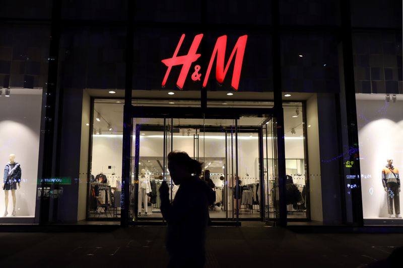 &copy; Reuters. A woman walks past a store of the Swedish fashion retailer H&M at a shopping mall in Beijing, China March 24, 2021. REUTERS/Florence Lo