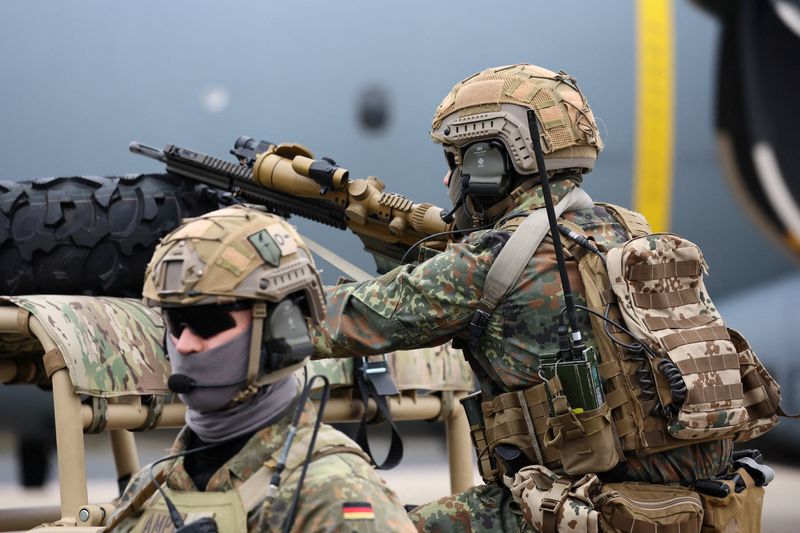 &copy; Reuters. FILE PHOTO: A member of Air Mobile Protection Team sits on a vehicle as German Chancellor Olaf Scholz visits the Cologne-Bonn Air Force base to attend a demonstration of the capabilities of the Territorial Command of the German army Bundeswehr in Wahn, a