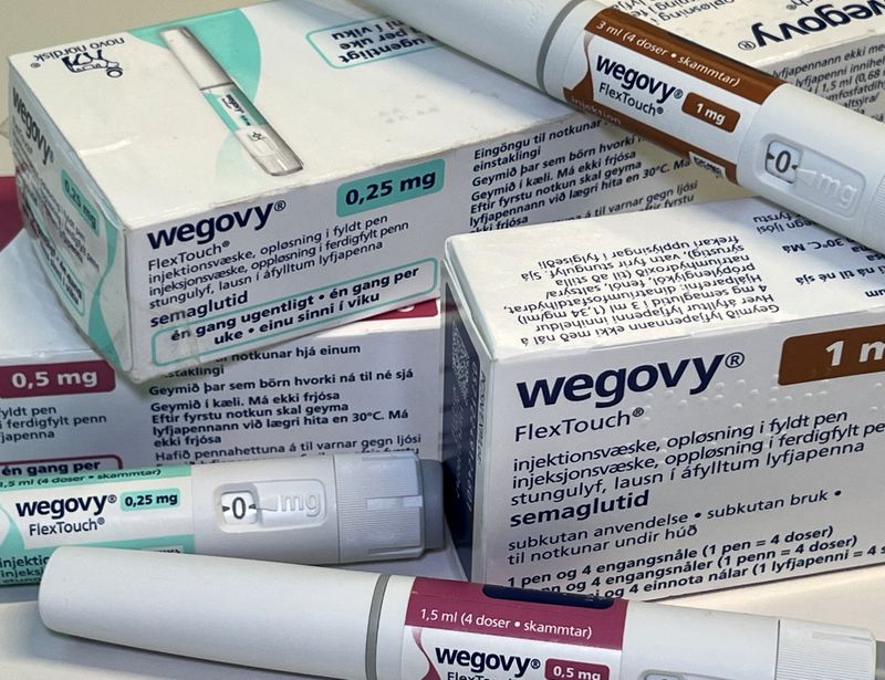 © Reuters. FILE PHOTO: Injection pens and boxes of Novo Nordisk's weight-loss drug Wegovy are shown in this photo illustration in Oslo, Norway, November 21, 2023. REUTERS/Victoria Klesty/Illustration/File Photo