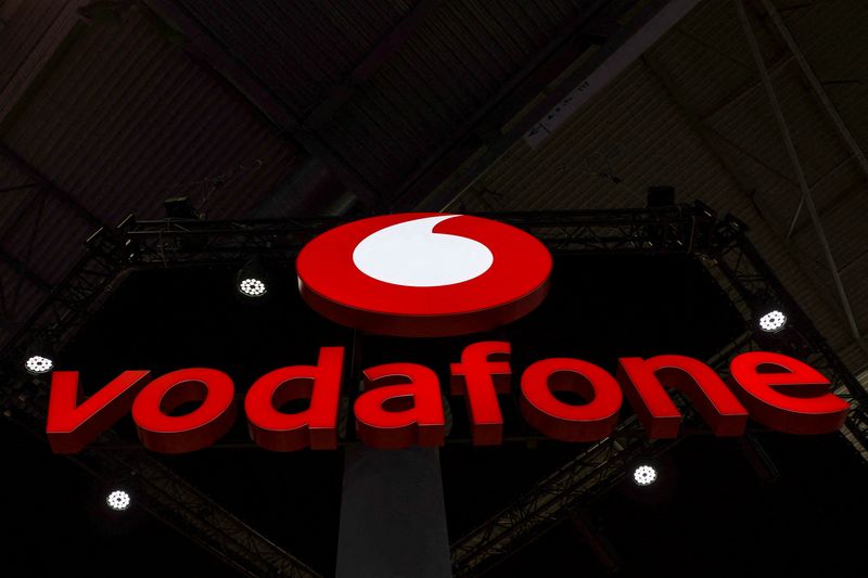 © Reuters. FILE PHOTO: Vodafone's logo is displayed, during the GSMA's 2023 Mobile World Congress (MWC) in Barcelona, Spain March 1, 2023. REUTERS/Nacho Doce/File Photo