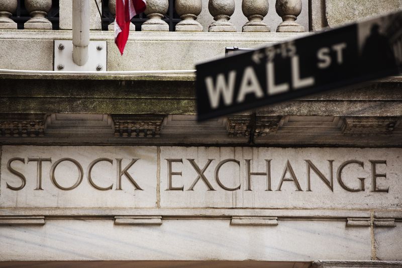 &copy; Reuters. A street sign for Wall Street hangs in front of the New York Stock Exchange May 8, 2013. REUTERS/Lucas Jackson/File Photo