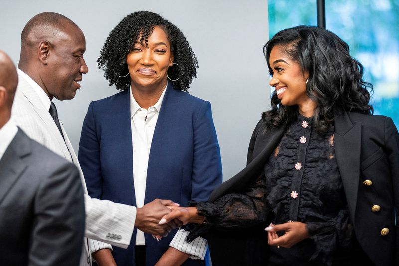 &copy; Reuters. FILE PHOTO: Attorney Ben Crump greets Fearless Fund co-partners Arian Simone and Ayana Parsons as they attend a press conference in New York, U.S., August 10, 2023. REUTERS/Eduardo Munoz/File Photo