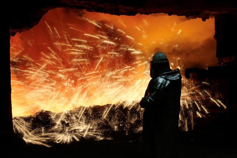 &copy; Reuters. FILE PHOTO: A steel worker in heat protection gear is silhouetted against the sparkling fire of Europe's largest furnace with a daily raw iron production of 12,000 tons, at the steel plant of ThyssenKrupp in Duisburg, Germany, November 16, 2023.  REUTERS/