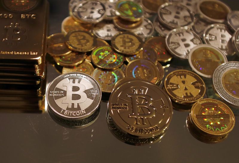 &copy; Reuters. Bitcoins created by enthusiast Mike Caldwell are seen in a photo illustration at his office in Sandy, Utah, September 17, 2013. REUTERS/Jim Urquhart/File Photo