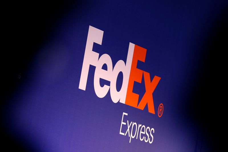 &copy; Reuters. People stand near the FedEx Express logo during the presentation of the future extension of the FedEx hub in Roissy-en-France, North of Paris, France, October 18, 2016. REUTERS/Philippe Wojazer/File Photo