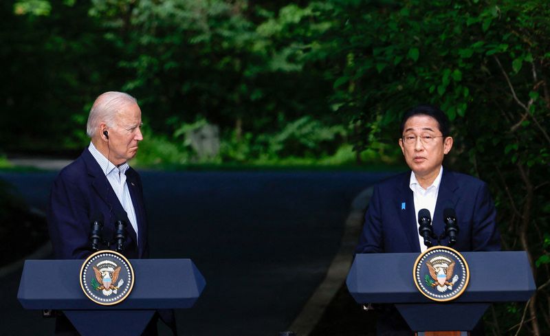 &copy; Reuters. FILE PHOTO: Japanese Prime Minister Fumio Kishida speaks next to U.S. President Joe Biden during a joint press conference with South Korean President Yoon Suk Yeol (not pictured) during the trilateral summit at Camp David near Thurmont, Maryland, U.S., Au