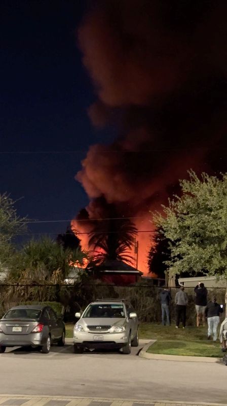 &copy; Reuters. A plume of smoke rises after a small plane crashes in a trailer park in Clearwater, Florida, U.S., February 1, 2024, in this screen grab obtained from a social media video. Steven Ascari/via REUTERS