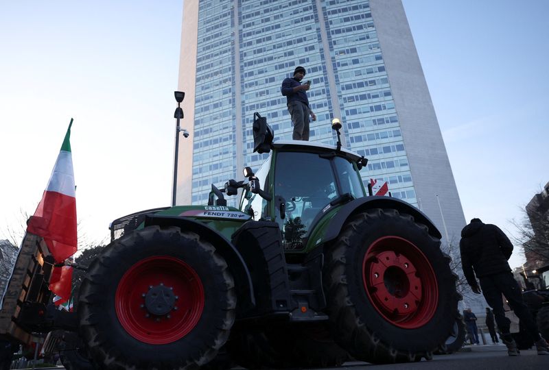 &copy; Reuters. A protester stands on a tractor during a protest against European agricultural policies, in front of the Regional Council of Lombardy in Milan, Italy, February 1, 2024. REUTERS/Claudia Greco