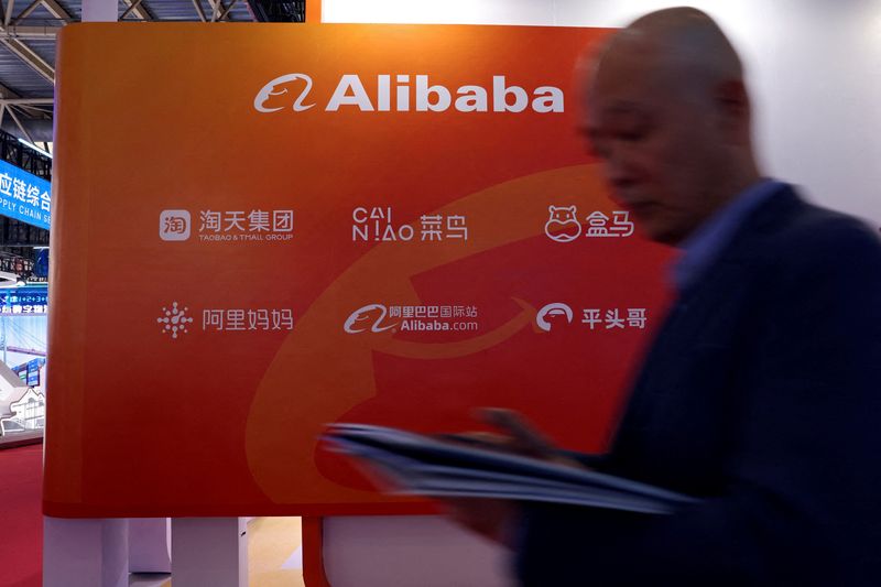 &copy; Reuters. FILE PHOTO: A man walks past the Alibaba booth during the first China International Supply Chain Expo (CISCE) in Beijing, China November 28, 2023. REUTERS/Florence Lo/File Photo