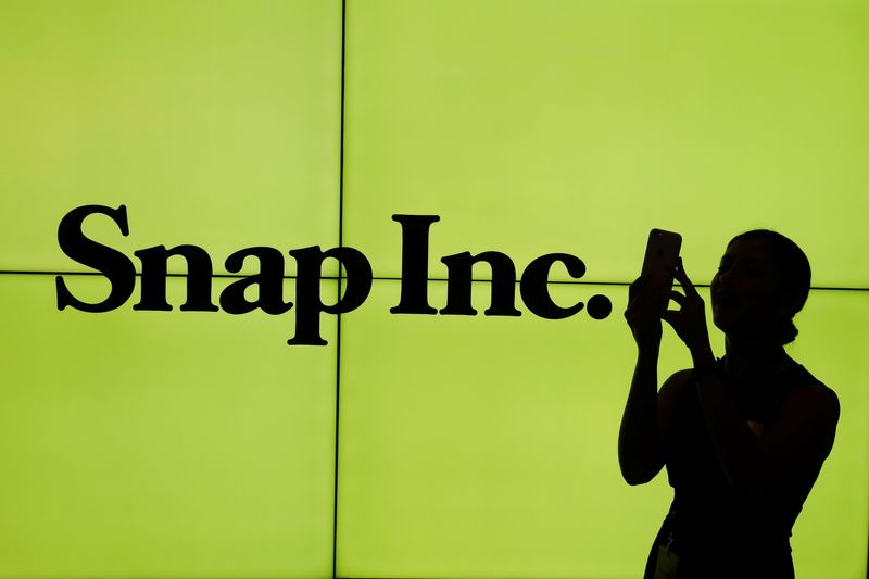 &copy; Reuters. A woman stands in front of the logo of Snap Inc. on the floor of the New York Stock Exchange (NYSE) while waiting for Snap Inc. to post their IPO, in New York City, NY, U.S. March 2, 2017. REUTERS/Lucas Jackson/File Photo