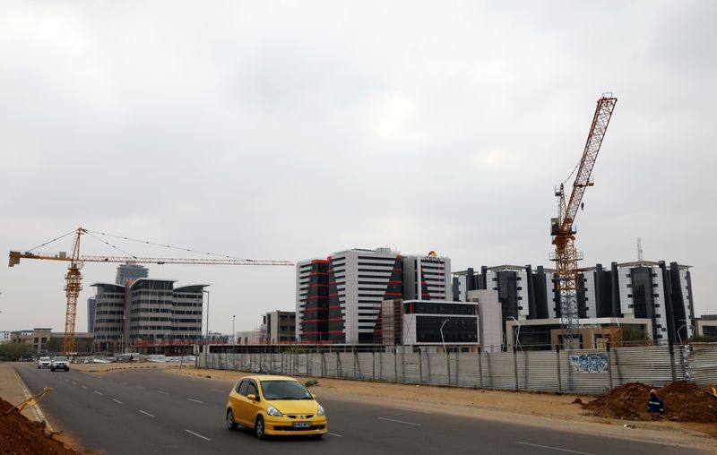 &copy; Reuters. A car drives past a construction site of the Central Business District (CBD) in the capital Gaborone, Botswana, September 21, 2018. REUTERS/Siphiwe Sibeko/File Photo