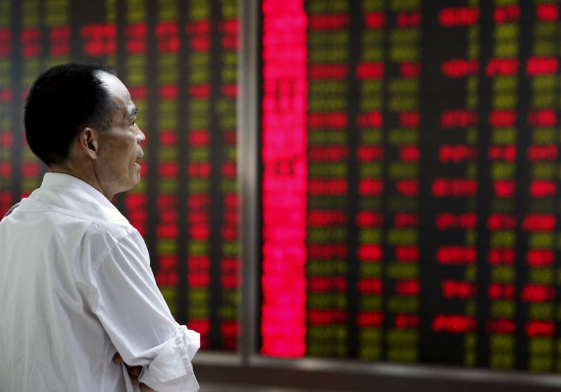&copy; Reuters. FILE PHOTO: An investor watches an electronic board showing stock information at a brokerage office in Beijing, China, July 9, 2015. REUTERS/Kim Kyung-Hoon