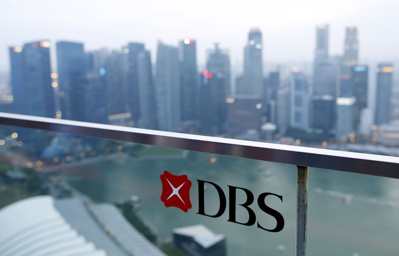 &copy; Reuters. FILE PHOTO: A DBS logo in pictured in the backdrop of the central business district in Singapore July 10, 2015. REUTERS/Edgar Su/File Photo