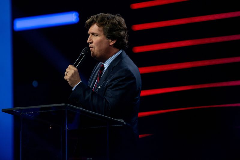 &copy; Reuters. FILE PHOTO: Tucker Carlson speaks as conservative leaders and personalities attend Turning Point USA's AmericaFest 2023 in Phoenix, Arizona, U.S. December 18, 2023.  REUTERS/Caitlin O’Hara