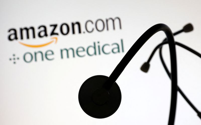 &copy; Reuters. A stethoscope is placed on displayed Amazon.com and One Medical logos in this illustration taken July 26, 2022. REUTERS/Dado Ruvic/Illustration/File Photo