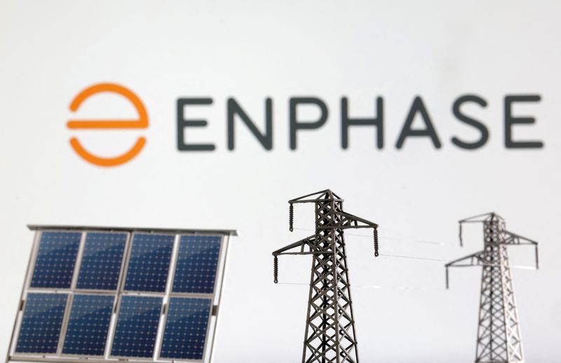 &copy; Reuters. Miniatures of solar panel and electric pole are seen in front of Enphase logo in this illustration taken January 17, 2023. REUTERS/Dado Ruvic/Illustration/File Photo