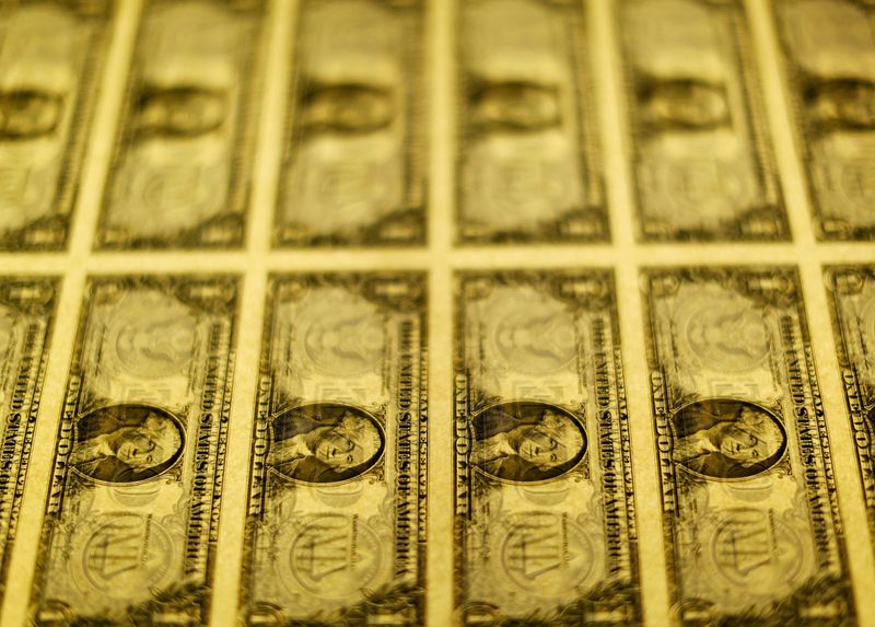 &copy; Reuters. FILE PHOTO: United States one dollar bills are seen on a light table at the Bureau of Engraving and Printing in Washington November 14, 2014.   REUTERS/Gary Cameron/File Photo