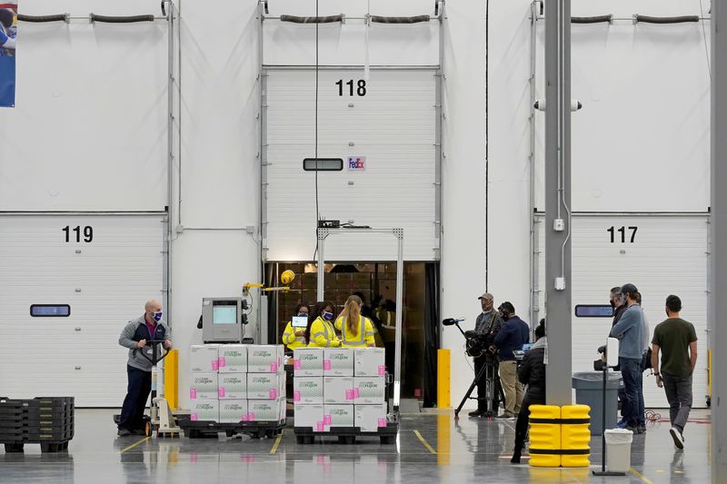 &copy; Reuters. Boxes containing the Moderna COVID-19 vaccine are prepared to be shipped at the McKesson distribution center in Olive Branch, Mississippi, U.S. December 20, 2020. Paul Sancya/Pool via REUTERS/File Photo