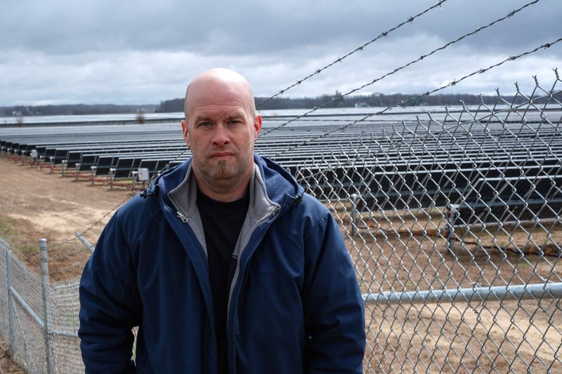 &copy; Reuters. Dave Duttlinger stands for a portrait on his farmland, next to land he leased to Dunns Bridge Solar LLC who constructed solar farms on top of it in Wheatfield, Indiana, U.S., April 5, 2024.  REUTERS/Jim Vondruska
