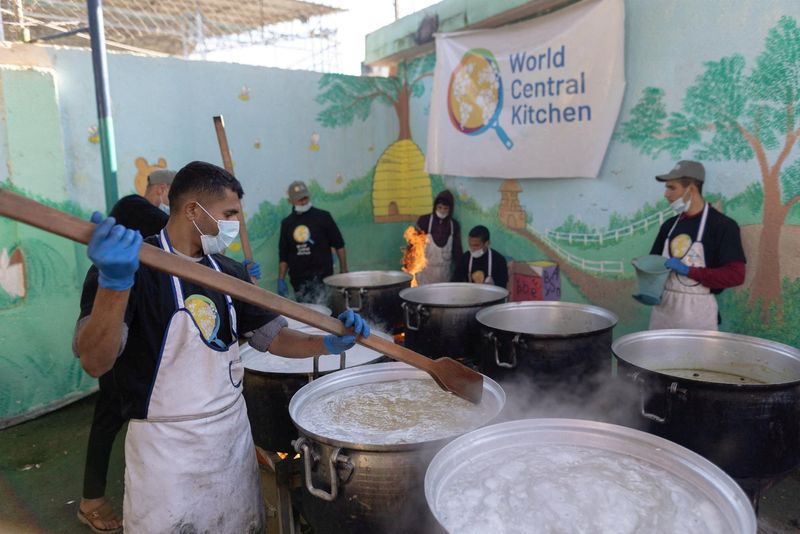 &copy; Reuters. FILE PHOTO: Members of "World Central Kitchen" prepare food for Palestinians, in the location given as Gaza, amid the ongoing conflict between Israel and Hamas,  in this picture released on March 21, 2024 and obtained from social media. Courtesy of @chefj