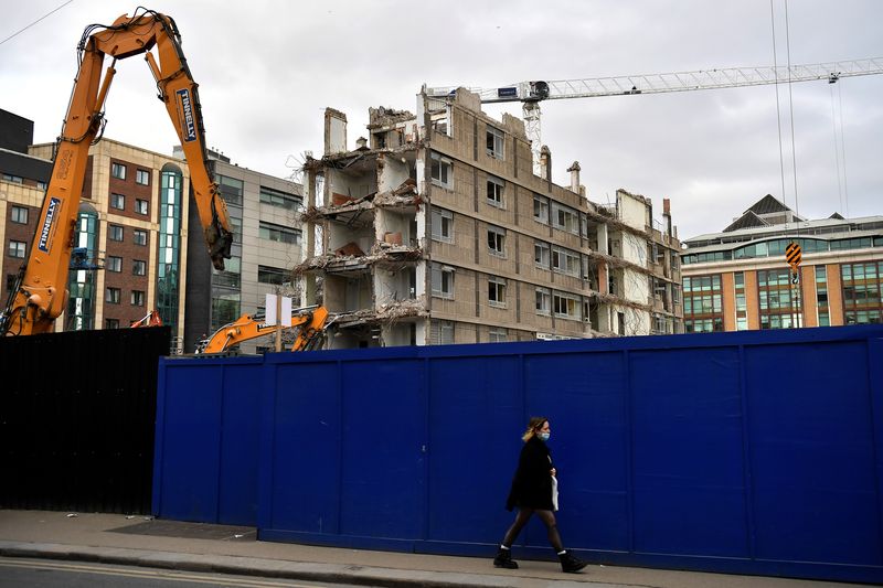 &copy; Reuters. A woman walks past a demolition site in the city centre of Dublin, Ireland, February 11, 2022. REUTERS/Clodagh Kilcoyne/ File photo