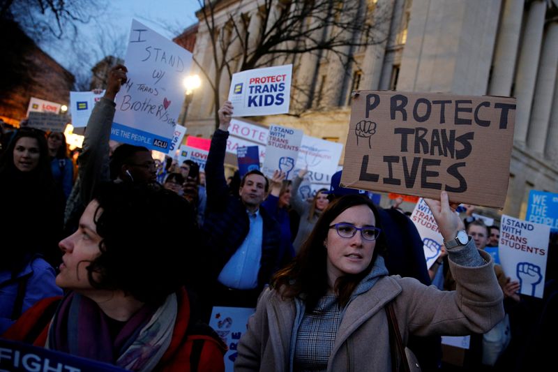 &copy; Reuters. FILE PHOTO: Transgender activists and supporters protest potential changes by the Trump administration in federal guidelines issued to public schools in defense of transgender student rights, near the White House in Washington, U.S. February 22, 2017. REU
