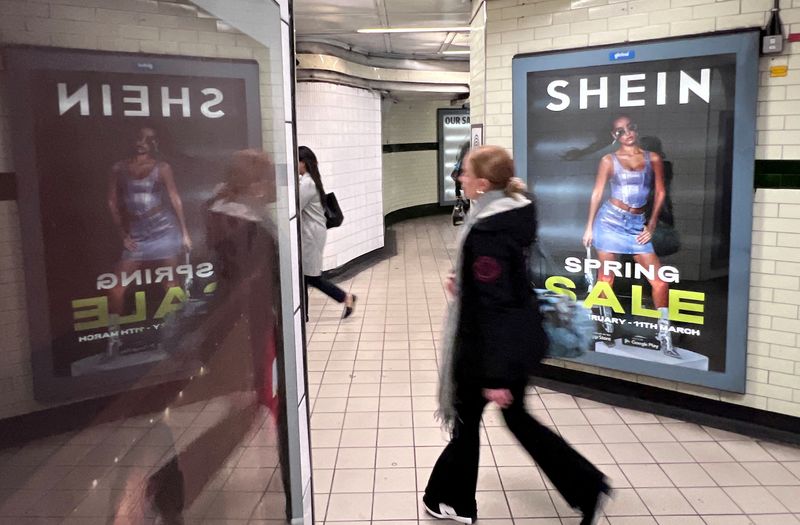 &copy; Reuters. FILE PHOTO: A person walks past an advertisement for Shein, in London, Britain, March 8, 2024. REUTERS/Suzanne Plunkett/File Photo