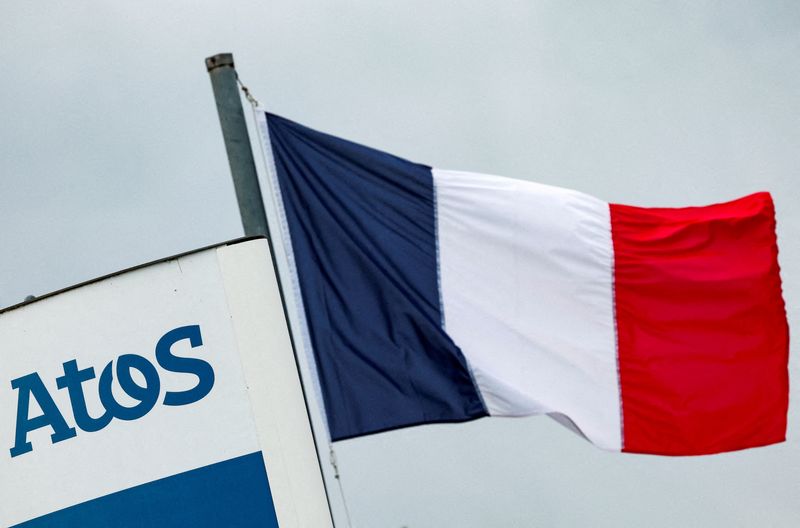 &copy; Reuters. FILE PHOTO: A French national flag flies near a logo of French IT consulting firm Atos, at the entrance of a company's building, in Angers, France, March 20, 2024. REUTERS/Stephane Mahe/File Photo