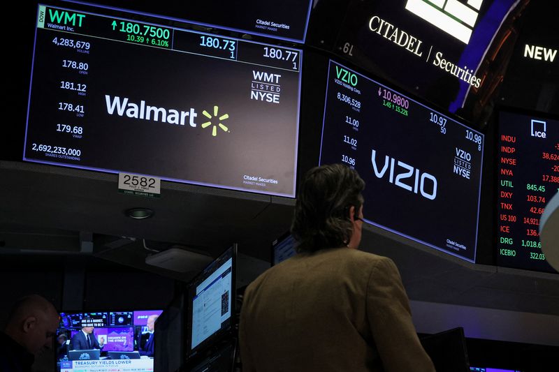 &copy; Reuters. FILE PHOTO: Screens display logos and trading information for Walmart and Vizio as a trader works on the floor at the New York Stock Exchange (NYSE) in New York City, U.S., February 20, 2024.  REUTERS/Brendan McDermid/File Photo