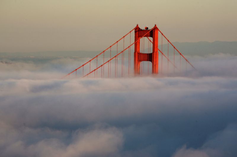 &copy; Reuters. FILE PHOTO: The South Tower of the Golden Gate Bridge appears above the evening fog as the suns sets on the Marin Headlands in Sausalito, California April 18, 2009. REUTERS/Robert Galbraith/File Photo