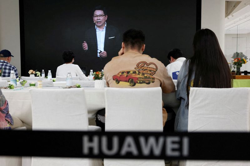 &copy; Reuters. FILE PHOTO: Richard Yu of Huawei Consumer Business Group is seen on a screen during the livestreaming of a Huawei launch event at a Huawei flagship store in Beijing, China, Sept. 25, 2023. REUTERS/Florence Lo/File Photo