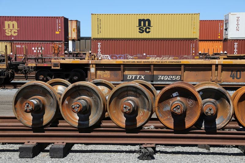 &copy; Reuters. Train wheels are stored next to shipping containers on rail cars at Roberts Bank Superport in Delta, British Columbia, Canada July 2, 2023. REUTERS/Chris Helgren/ File Photo