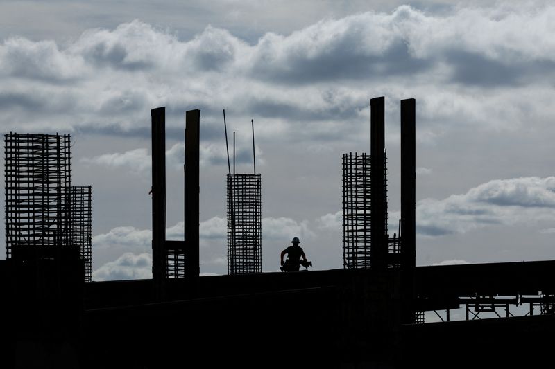 &copy; Reuters. FILE PHOTO: A construction worker is silhouetted against the morning sky while working on a  project in San Diego, California U.S., March 5, 2024.  REUTERS/Mike Blake/File Photo