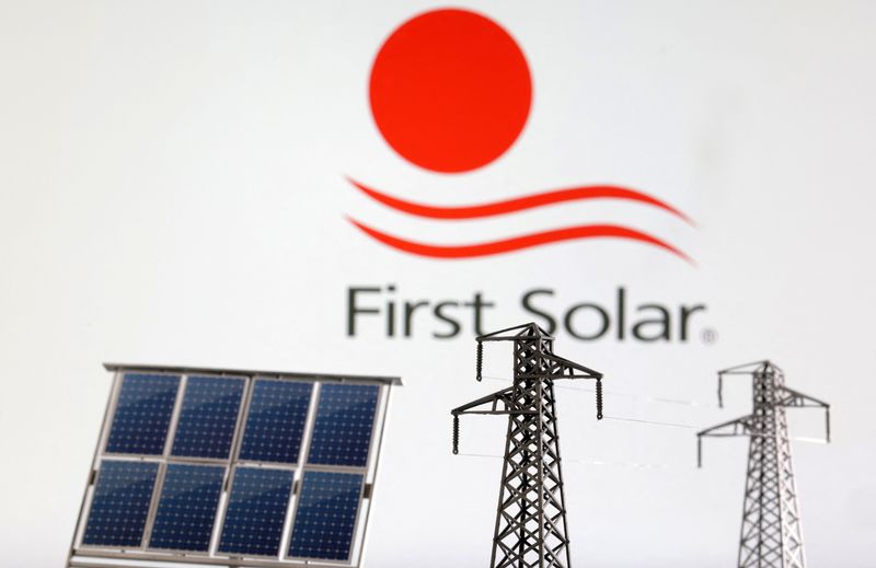 &copy; Reuters. Miniatures of solar panel and electric pole are seen in front of First Solar logo in this illustration taken January 17, 2023. REUTERS/Dado Ruvic/Illustration/File Photo
