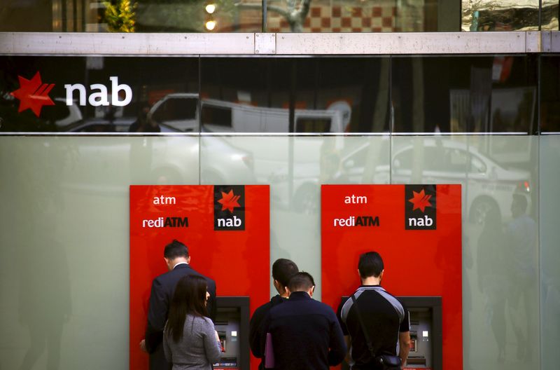&copy; Reuters. Customers withdraw money from National Australia Bank (NAB) Automatic Teller Machines (ATMs) in central Sydney, Australia, July 24, 2015. REUTERS/David Gray/File photo