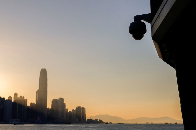 &copy; Reuters. A surveillance camera is seen by the waterfront as skyline buildings stand across Victoria Harbor, in Hong Kong, China October 24, 2023. REUTERS/Tyrone Siu/File Photo