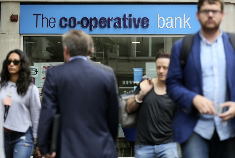 &copy; Reuters. People walk past a branch of the Co-Operative Bank in central London, Britain August 20, 2015. REUTERS/Paul Hackett/File Photo